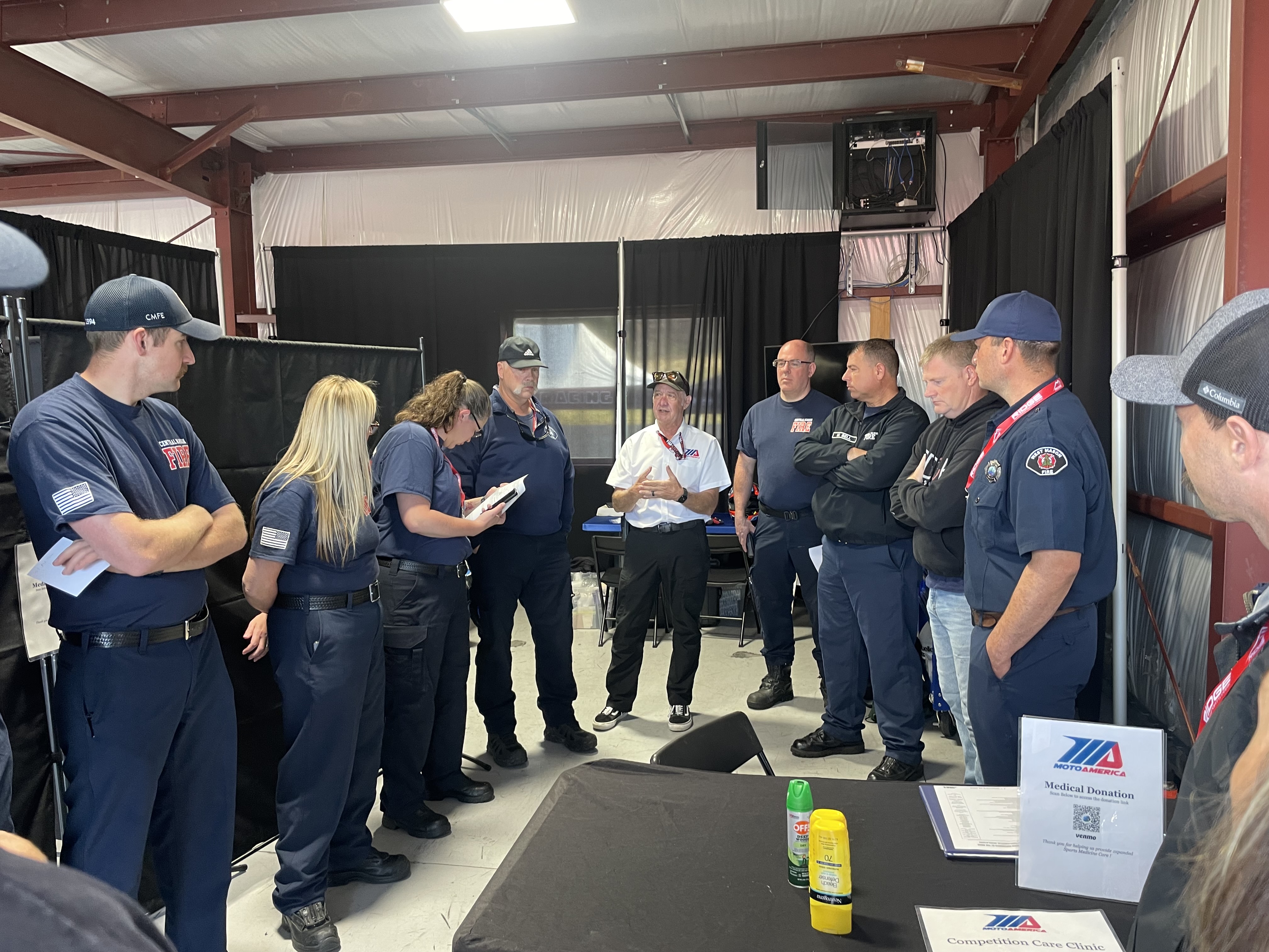Dr. Price briefing medical and safety crew at MotoAmerica paddock